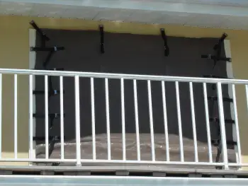 EZMax removable hurricane screen installed over doors in a Florida home